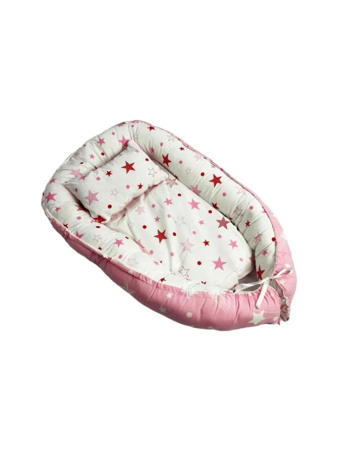 Babynest mit Kissen in Rosa