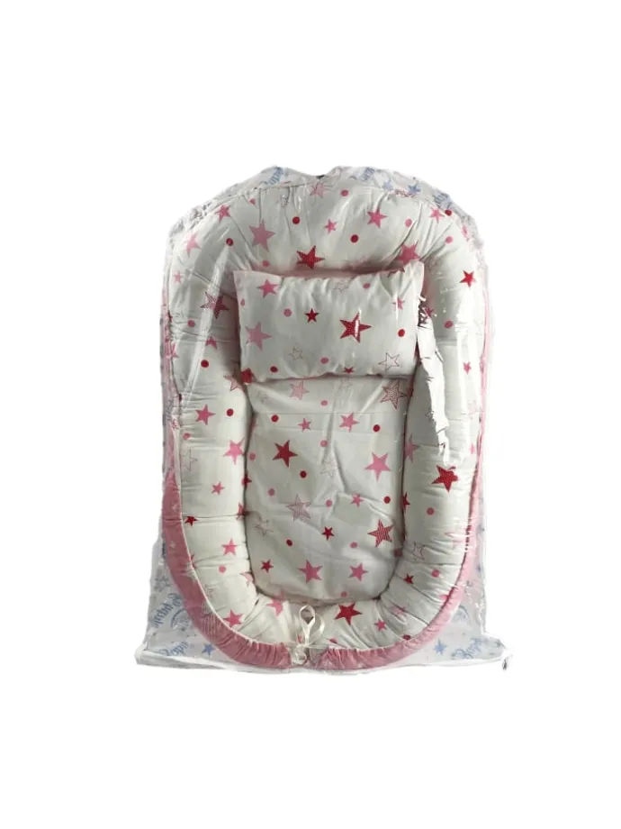 Babynest mit Kissen in Rosa
