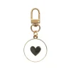 Schlüsselanhänger "Herz" in Gold/ Weiß/ Schwarz - (L)6,8 cm